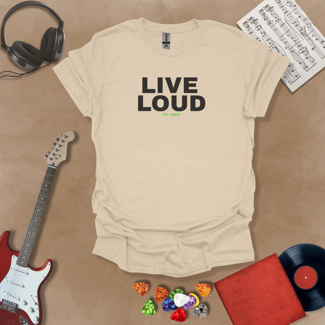 Live Loud – Jax Edition beige graphic t-shirt featuring bold stacked text with minimalist guitar headstock accent and subtle Riff Junkie branding. Motivational guitar apparel design.