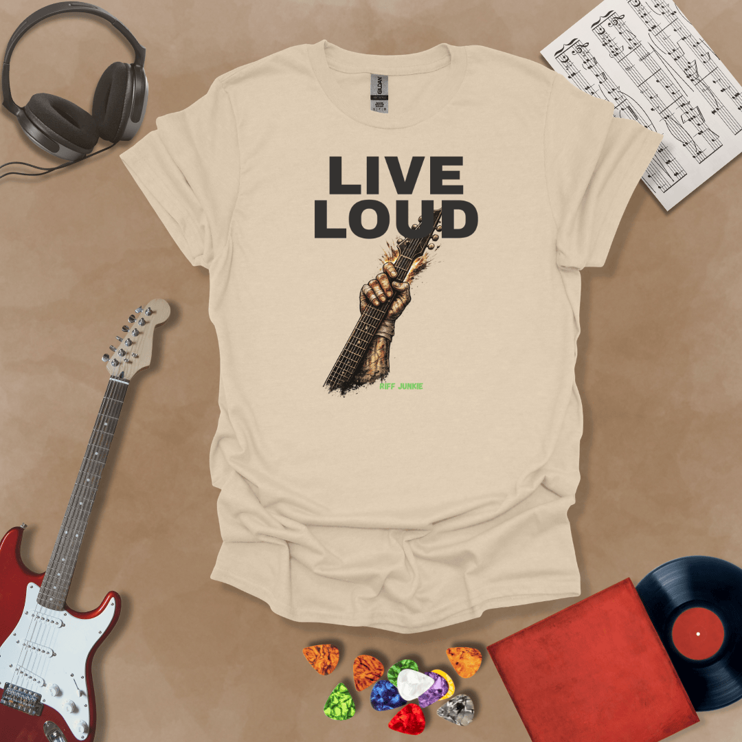 Live Loud – Riff Edition beige graphic t-shirt featuring bold stacked text with a weathered hand raising a guitar neck upward through the design and subtle Riff Junkie branding.
