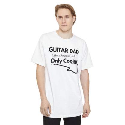 A male wearing a white Guitar Dad Signature Edition Tall Fit t-shirt featuring a light beige guitar-inspired graphic on the front with integrated typography, designed with extra length for a comfortable fit.