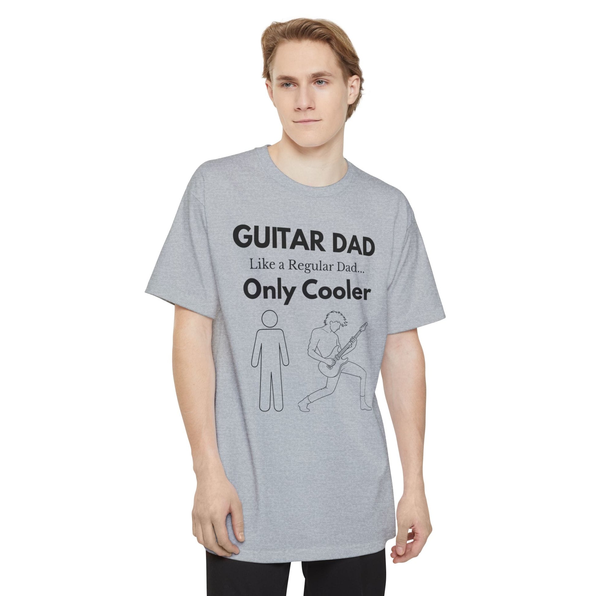 A male wearing a gray Guitar Dad Signature Edition Tall Fit t-shirt featuring an integrated guitar typography design on the front, created with extra length for a comfortable fit.