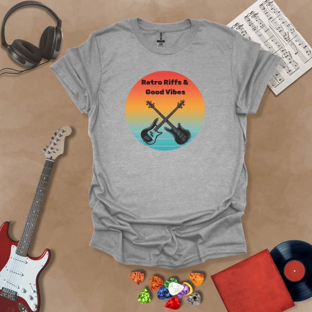 Gray t-shirt with Two guitars crossed in front of sunset, text 'Retro Riffs & Good Vibes'